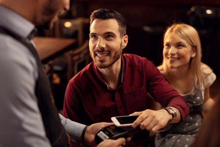 Mobile phone displaying akang platform with game categories and live tables